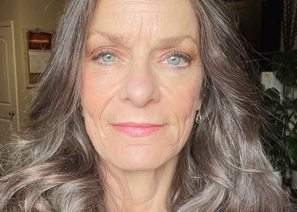 Person photographed indoors, facing the camera in a close-up portrait.